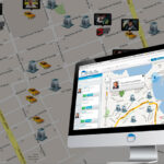 A composite image showcasing a logistics or fleet tracking system, with a computer monitor displaying the "Bliss" app overlaid on a larger map.